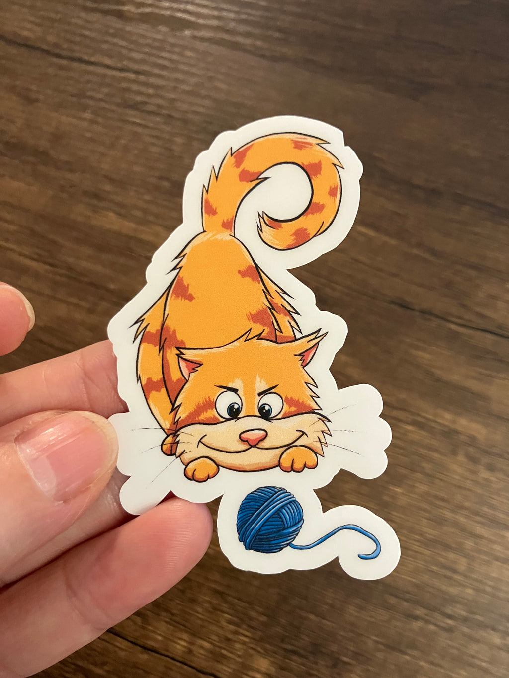 Orange cat yarn pounce 3" sticker