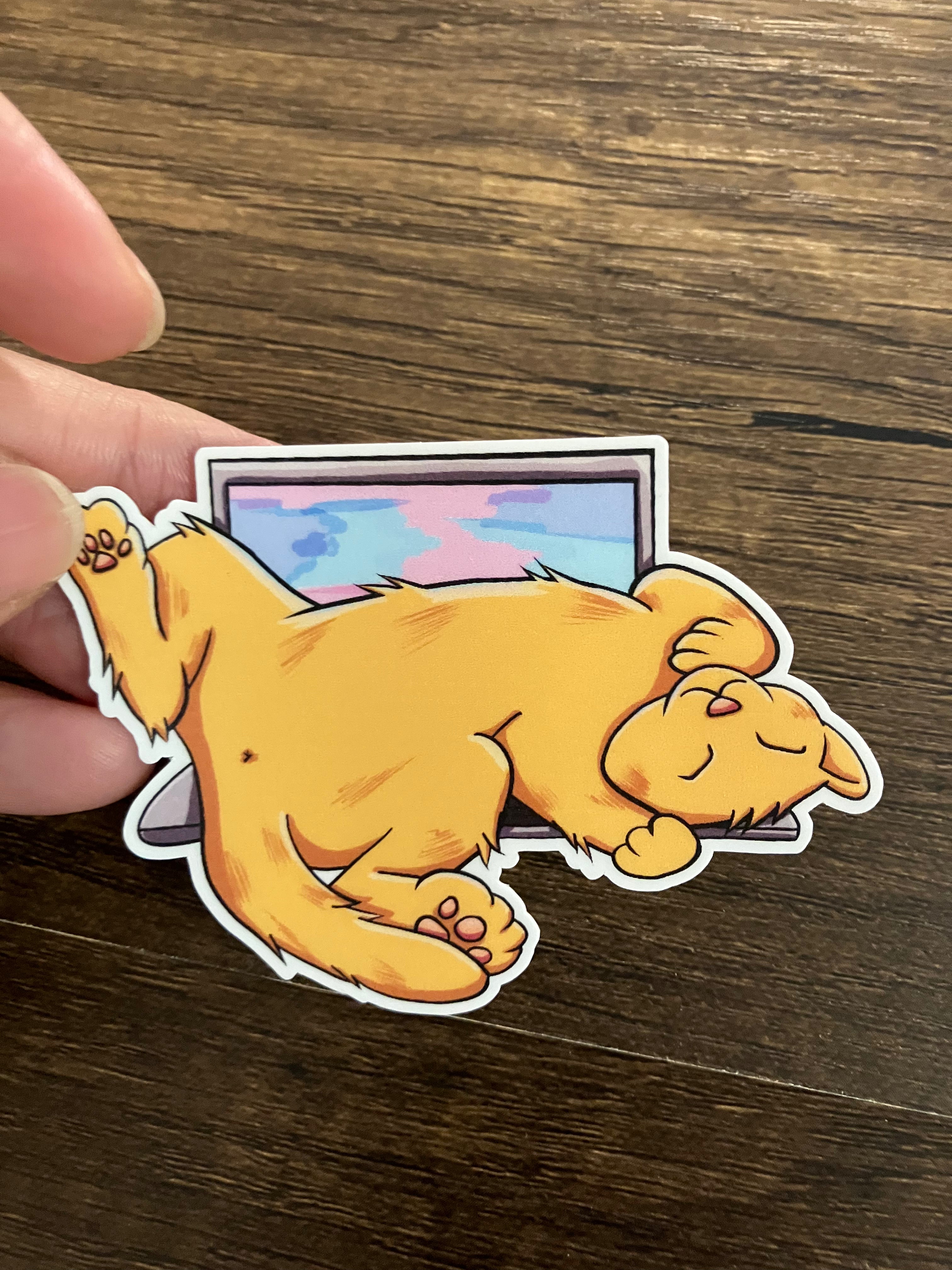 Orange cat on laptop 3" sticker