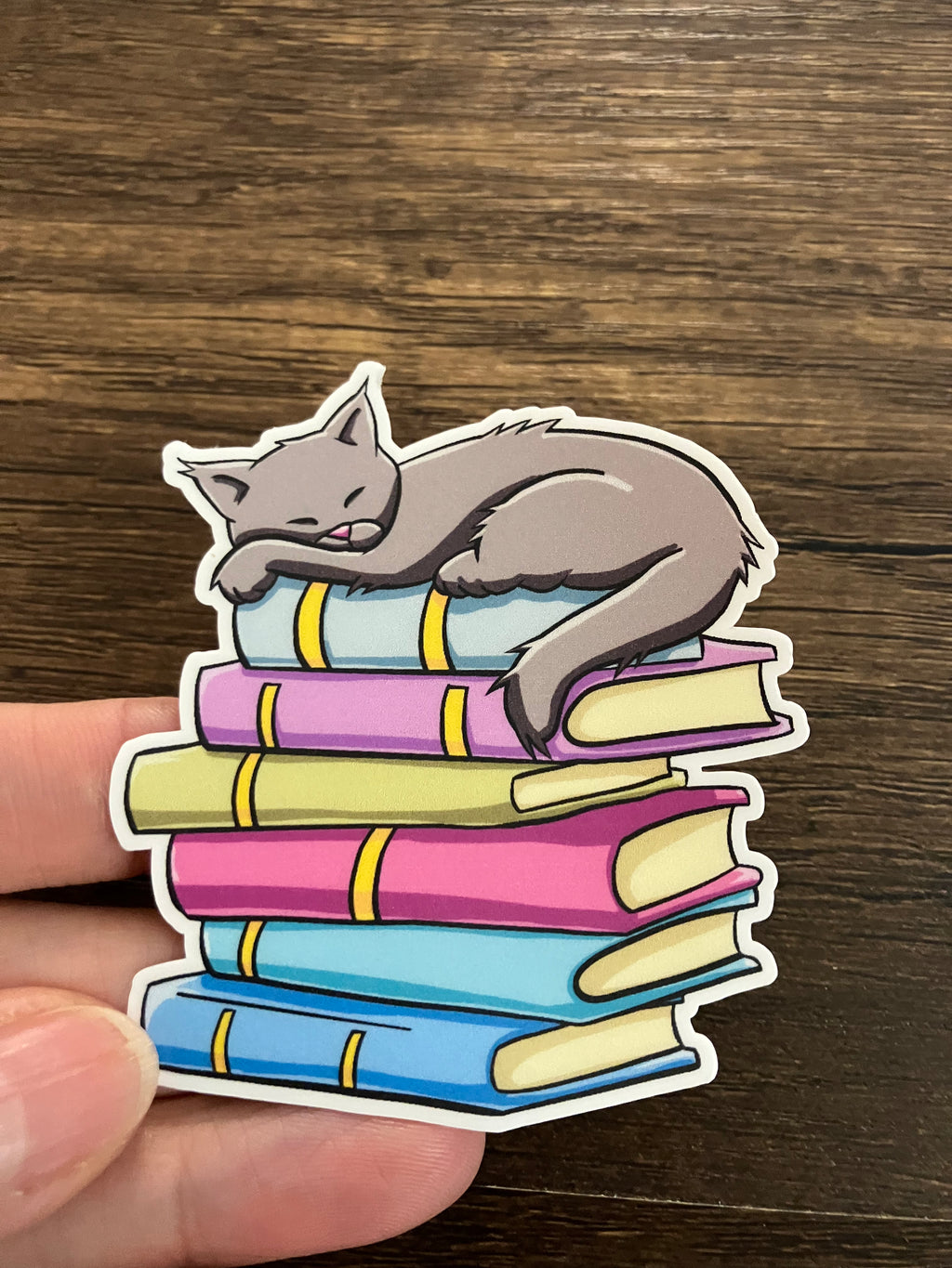 Grey cat on books 3" sticker